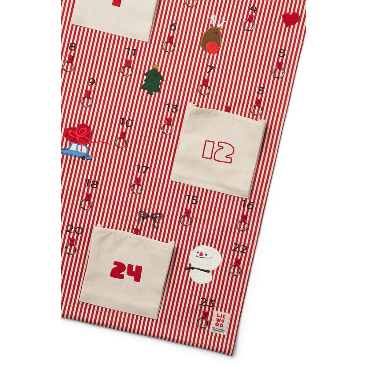 Nahaufnahme der nummerierten Taschen und Weihnachtsmotive auf dem rot gestreiften Adventskalender Blaise.